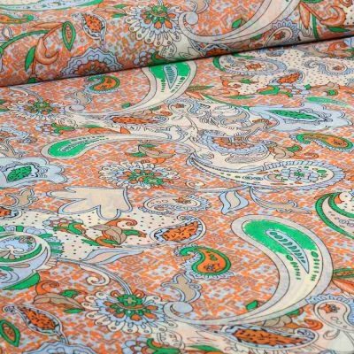 Tissu Mousseline Paisley sur fond Bleu ciel - Par 10 cm