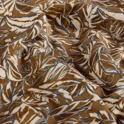 Tissu Sweat léger French Terry Marina extensible feuilles Ecru sur fond Marron - Par 10 cm