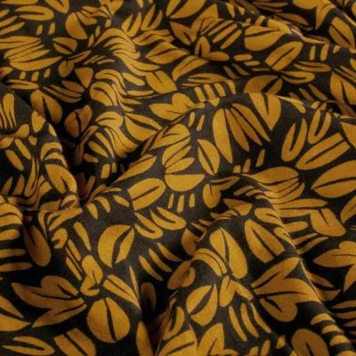 Tissu Sweat léger French Terry Emily feuillages stylisés Moutarde sur fond Noir - Par 10 cm
