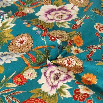 Tissu coton imprimé motifs floraux Japonais sur fond Bleu turquoise - Par 10 cm