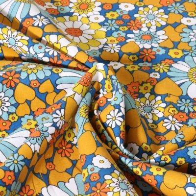 Tissu Coton imprimé Chill Fleuris jaune sur fond Bleu denim - Par 10 cm