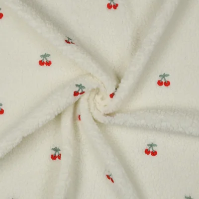 Tissu Fausse fourrure Mouton Lison cerises Rouges sur fond Ecru - Par 10 cm