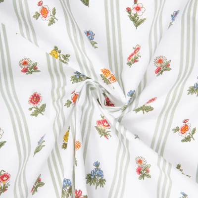 Tissu Coton imprimé Arty Fleurs et rayures Vert amande sur fond Blanc - Par 10 cm