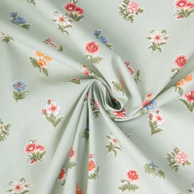 Tissu Coton imprimé Arty Demoiselle petits fleurs sur fond Vert amande - Par 10 cm