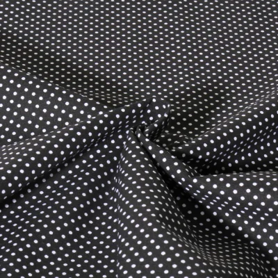 Tissu Popeline de Coton  Carmella à pois blanc sur fond Noir - Par 10 cm