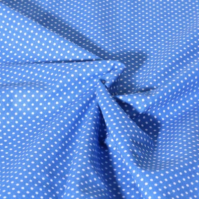 Tissu Popeline de Coton  Carmella à pois blanc sur fond Bleu azur - Par 10 cm