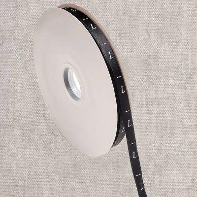 Ruban étiquettes 10 mm Taille L sur fond Noir