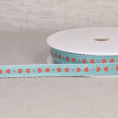 Ruban imprimé 15 mm coeurs sur fond Bleu clair x1m