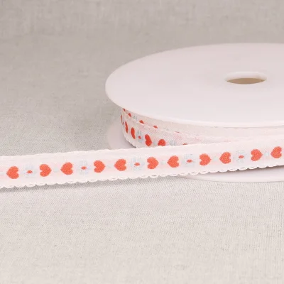 Ruban imprimé 15 mm coeurs sur fond Rose pâle x1m