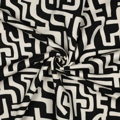 Tissu Sweat envers polaire Côme labyrinthe écru sur fond Noir - Par 10 cm