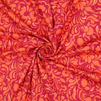 Tissu Viscose élasthanne stretch Motif floral Orange sur fond Rouge - Par 10 cm