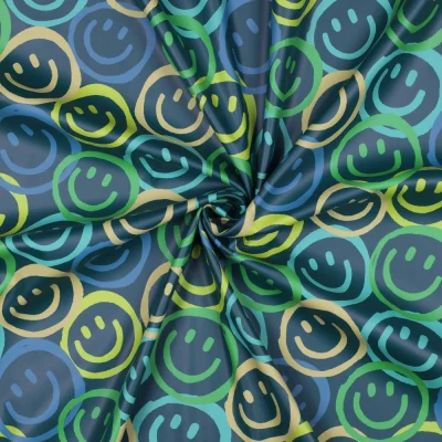 Tissu Imperméable digital Happy smileys sur fond Bleu pétrole - Par 10 cm