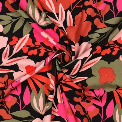 Tissu Viscose lenzing EcoVero Clara grandes fleurs Vert et Orange sur fond Noir - Par 10 cm