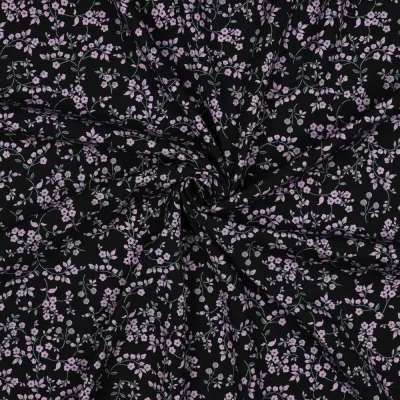 Tissu Viscose élasthanne stretch Petites fleurs Lilas sur fond Noir - Par 10 cm