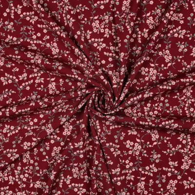 Tissu Viscose élasthanne stretch Petites fleurs Rose sur fond Bordeaux - Par 10 cm