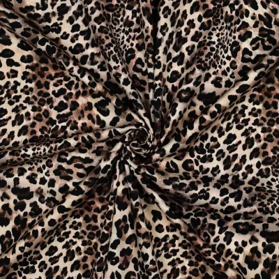 Tissu Viscose élasthanne stretch digital Rosella motif léopard sur fond Ecru - Par 10 cm
