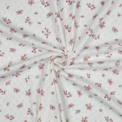 Tissu Jersey Coton ajouré Baby petits papillons sur fond Blanc cassé - Par 10 cm