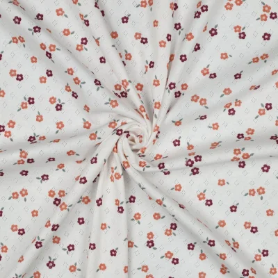 Tissu Jersey Coton ajouré Baby petites fleurs Orange et Violet sur fond Blanc - Par 10 cm