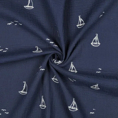 Tissu Double gaze de Coton Petits bateaux brodées Blanc sur fond Bleu marine - Par 10 cm