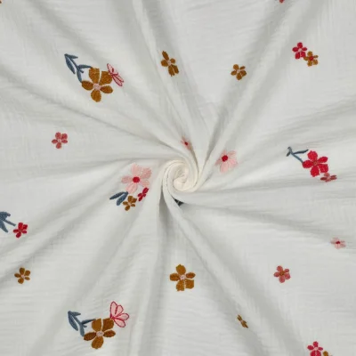 Tissu Double gaze de Coton Fleurs Brodés Zélyne ocre rouge sur fond Blanc - Par 10 cm