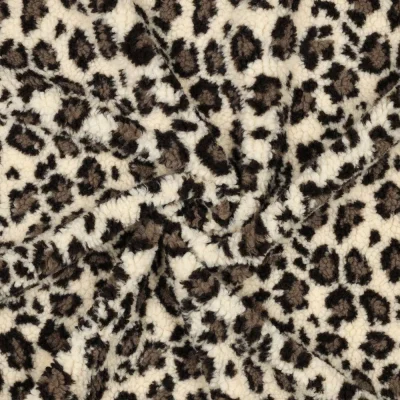 Tissu Fausse fourrure Teddy Bouclettes motif léopard sur fond Ecru - Par 10 cm
