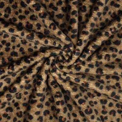 Tissu Doudou bicôté imprimé Léopard sur fond Marron - Par 10 cm
