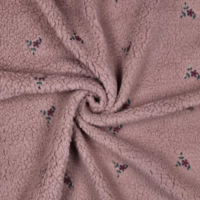 Tissu Bouclette Teddy Fleurs Maya brodées sur fond Vieux rose - Par 10 cm