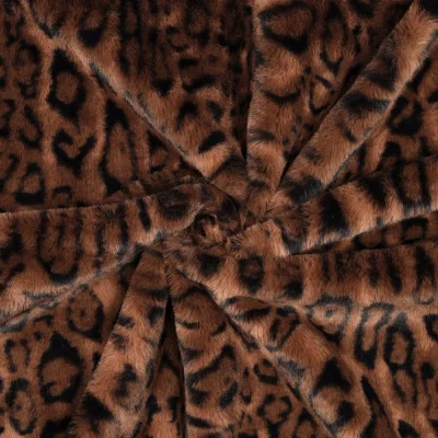 Tissu Fausse fourrure poils long Motif léopard sur fond Marron - Par 10 cm