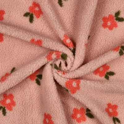 Tissu Bouclette imprimé Fleuris sur fond Saumon - Par 10 cm