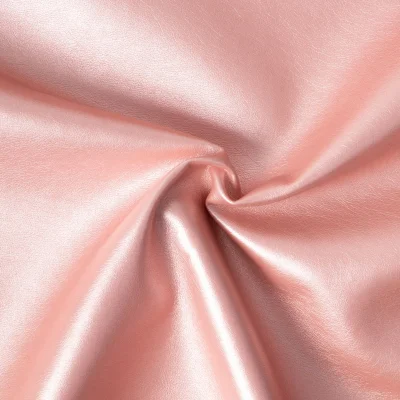 Tissu Simili cuir d&#039;habillement métallisé souple uni Rose poudré - Par 10 cm