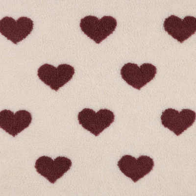 Tissu Fausse fourrure Mouton coeurs Lina rouges sur fond Beige - Par 10 cm