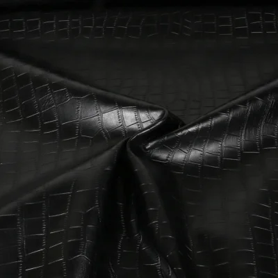 Tissu Simili cuir d&#039;habillement Croco uni Noir - Par 10 cm