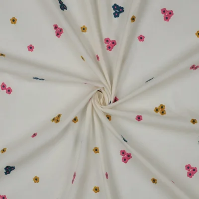 Tissu Voile de Coton brodé Petites fleurs Rose, Bleu et Or sur fond Ecru - Par 10 cm