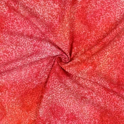 Tissu Batik de Viscose floral lumineux sur fond Rose corail - Par 10 cm