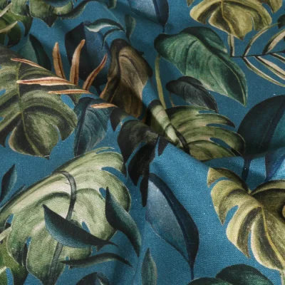 Tissu Toile de Coton Canvas Feuilles tropicales sur fond Bleu canard - Par 10 cm