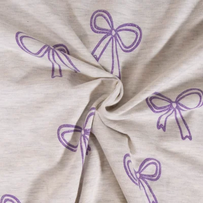 Tissu Jersey Mélangé Poppy Noeuds pailletés violets sur fond Ecru chiné - Par 10 cm
