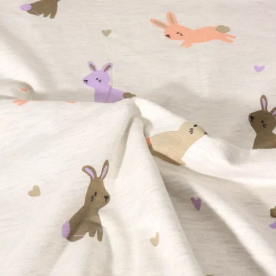 Tissu Jersey Polycoton Poppy Lapinou sur fond Ecru chiné - Par 10 cm
