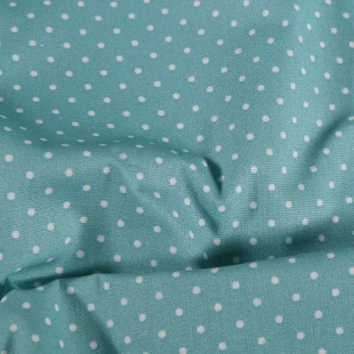 Tissu Coton enduit Petits pois blancs sur fond vert d&#039;eau - Par 10 cm