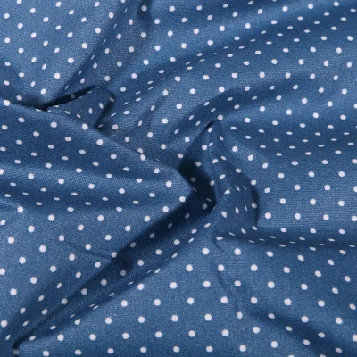 Tissu Coton enduit Petits pois blancs sur fond Bleu denim - Par 10 cm