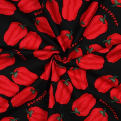 Tissu Toile de Coton Canvas Poivrons rouges sur fond Noir - Par 10 cm
