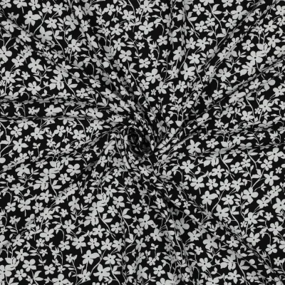 Tissu Viscose imprimé Petites fleurs Blanche sur fond Noir - Par 10 cm