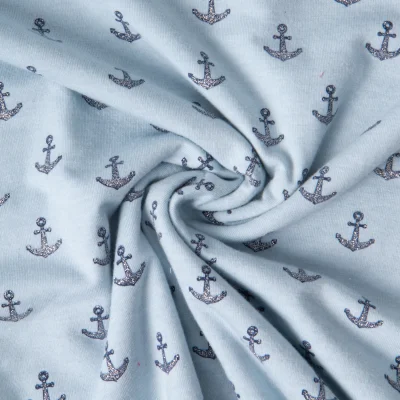 Tissu Jersey Coton Pailleté Ancres Bleu marine sur fond Bleu ciel - Par 10 cm