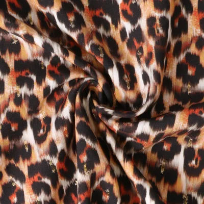 Tissu Viscose Lurex Féline taches fauves et noirs sur fond Blanc - Par 10 cm