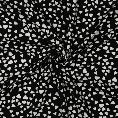 Tissu Viscose EcoVero petits coeurs Blanc sur fond Noir - Par 10 cm