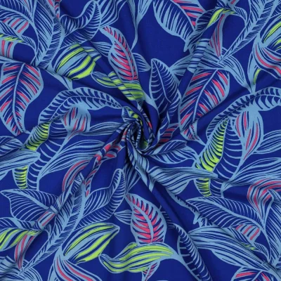 Tissu Viscose EcoVero feuilles Tropicales sur fond Bleu cobalt - Par 10 cm