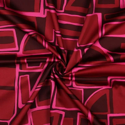 Tissu Coton satiné motifs géométrique sur fond Bordeaux - Par 10 cm