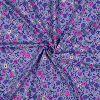 Tissu Jersey Coton imprimé Petites fleurs multicolores sur fond Lilas - Par 10 cm