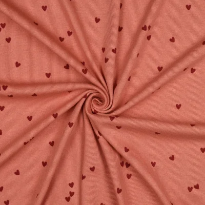 Tissu Jersey Coton côtelé petits coeurs Bordeaux sur fond Terracotta - Par 10 cm