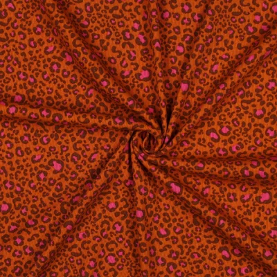 Tissu Jersey Coton côtelé Léopard Chocolat &amp; Rose pop sur fond Rouille - Par 10 cm