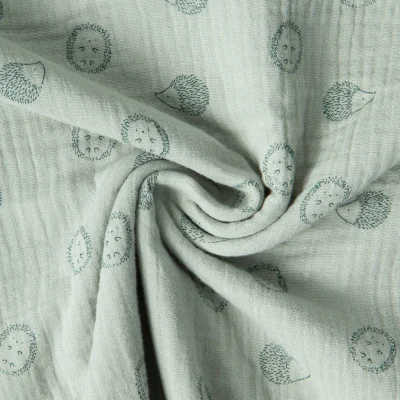 Tissu Double Gaze de Coton Poppy petits Hérissons sur fond Vert pastel - Par 10 cm